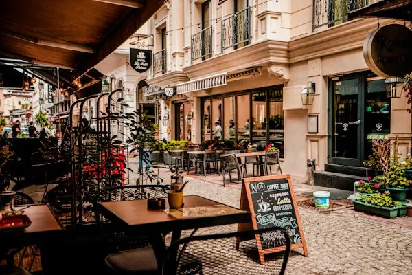 Café tables on a cobblestone street